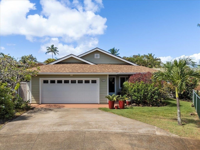 ranch-style home with a garage, fence, a front yard, a shingled roof, and concrete driveway
