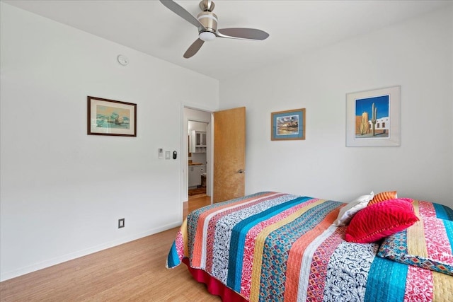 bedroom featuring baseboards, ceiling fan, and wood finished floors