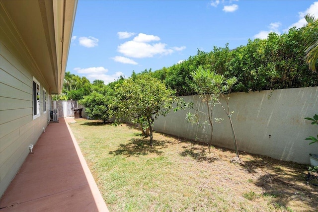 view of yard with a fenced backyard