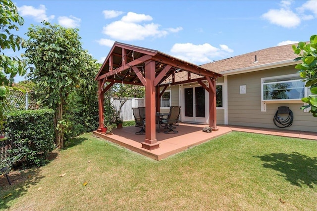 exterior space featuring a gazebo, a patio area, and fence