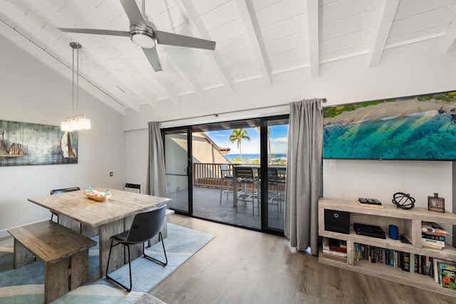 dining space featuring hardwood / wood-style flooring, ceiling fan, lofted ceiling with beams, and wooden ceiling