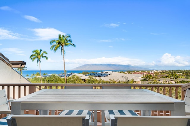 exterior space with a water and mountain view