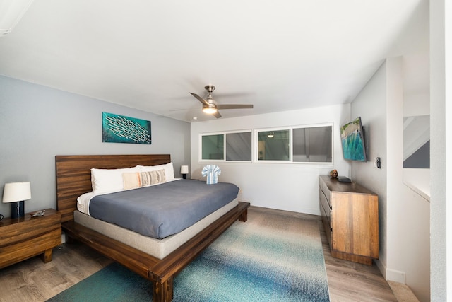 bedroom featuring ceiling fan and light hardwood / wood-style flooring