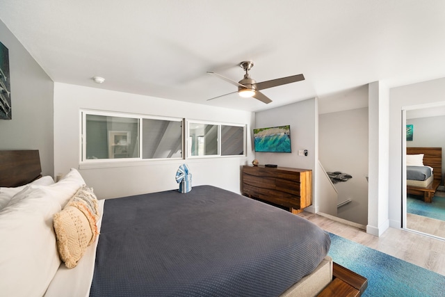 bedroom featuring ceiling fan and light wood-type flooring