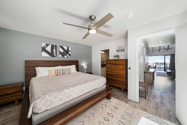 bedroom with ceiling fan and hardwood / wood-style floors