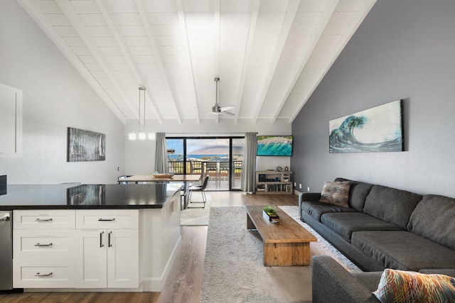 living room with beamed ceiling, high vaulted ceiling, ceiling fan, and light hardwood / wood-style floors