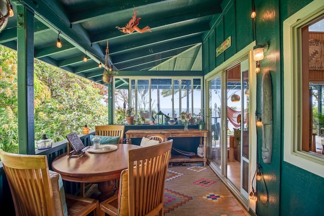 sunroom featuring beamed ceiling