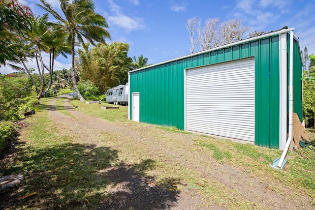 garage with a lawn