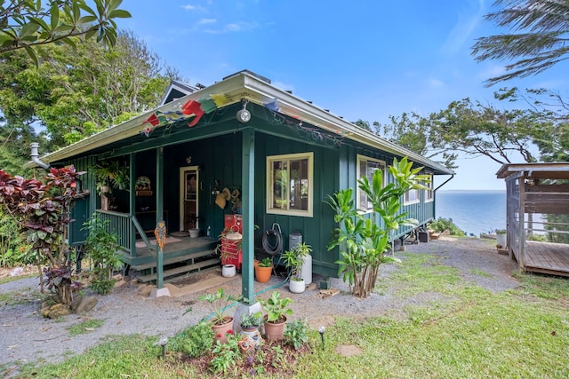 view of front of home with a water view