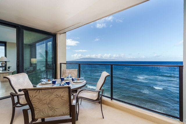 balcony featuring a water view