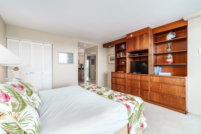 carpeted bedroom featuring a closet