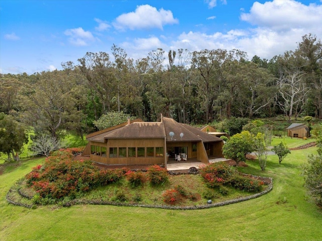 2450 Piiholo Rd, Makawao, HI 96768 - back of property with a yard, a forest view, and a patio area