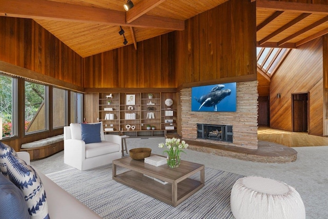 2450 Piiholo Rd, Makawao, HI 96768 - living room featuring wood walls, high vaulted ceiling, wood ceiling with exposed beams, a fireplace, and carpet flooring
