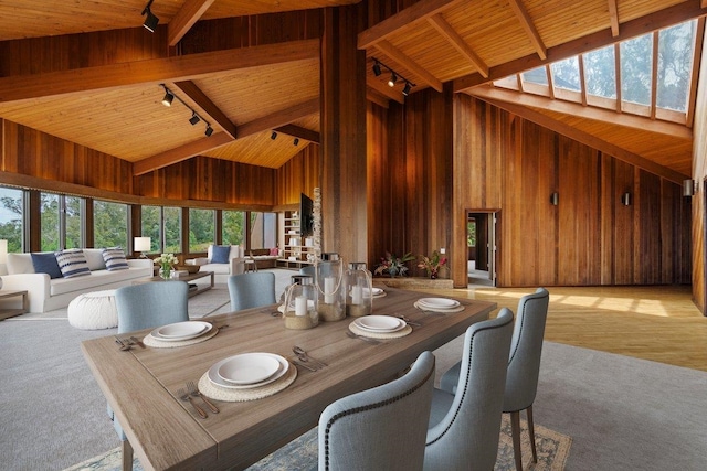 2450 Piiholo Rd, Makawao, HI 96768 - dining space featuring high vaulted ceiling, track lighting, wood ceiling with exposed beams, wooden walls, and light colored carpet