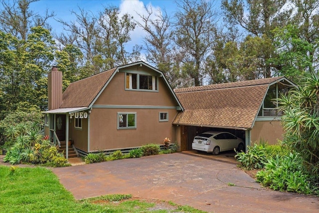 2450 Piiholo Rd, Makawao, HI 96768 - rear view of property with concrete driveway, a chimney, stucco siding, and an attached carport