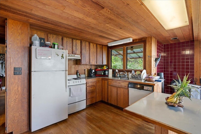 2450 Piiholo Rd, Makawao, HI 96768 - kitchen featuring white appliances, brown cabinets, wooden ceiling, dark wood-style floors, and a sink