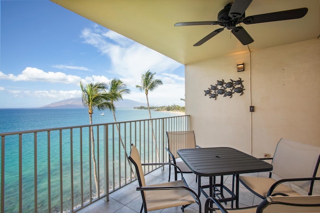 balcony featuring ceiling fan and a water and mountain view