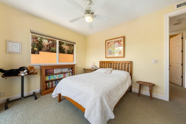 bedroom with ceiling fan and light colored carpet