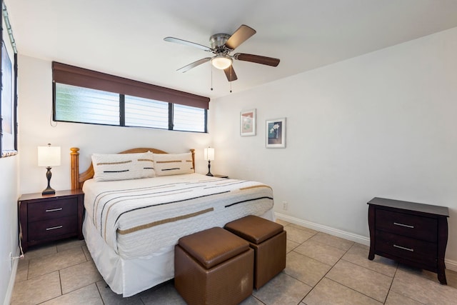 tiled bedroom with ceiling fan