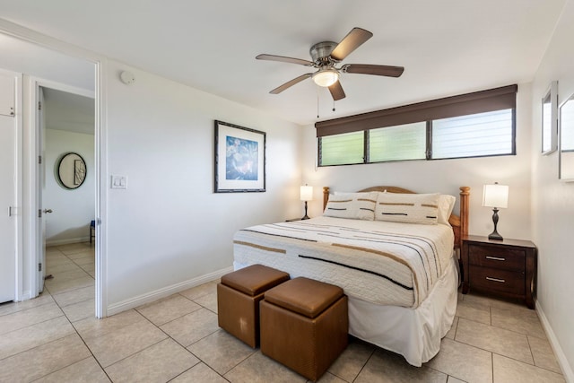 bedroom with ceiling fan and light tile patterned flooring