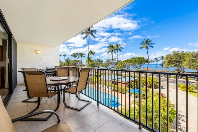 balcony featuring a water view