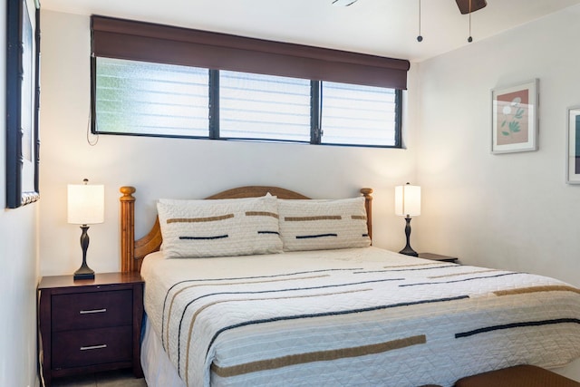 bedroom featuring ceiling fan and multiple windows