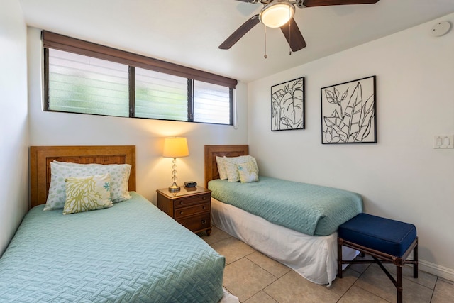 tiled bedroom with ceiling fan