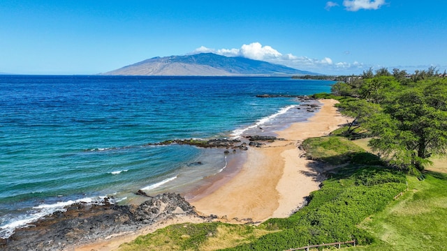 water view with a mountain view and a beach view