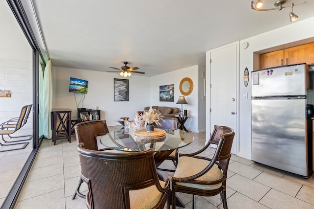 dining room featuring ceiling fan and light tile patterned floors