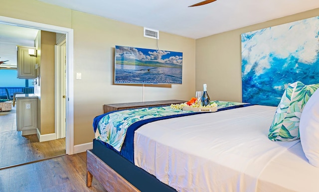 bedroom featuring ceiling fan and light wood-type flooring