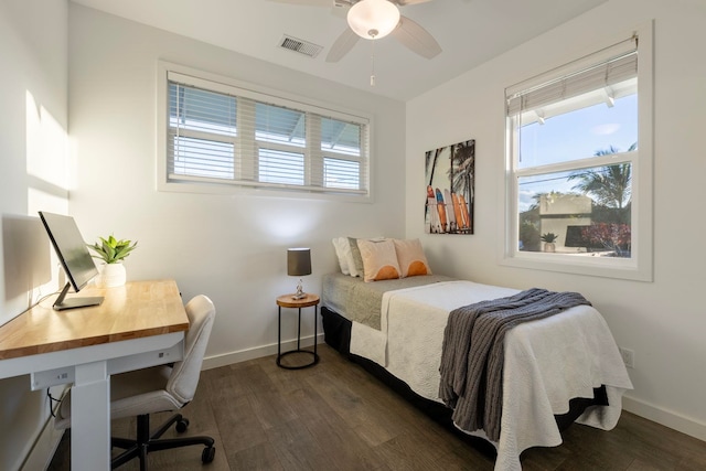 bedroom with ceiling fan and dark hardwood / wood-style floors