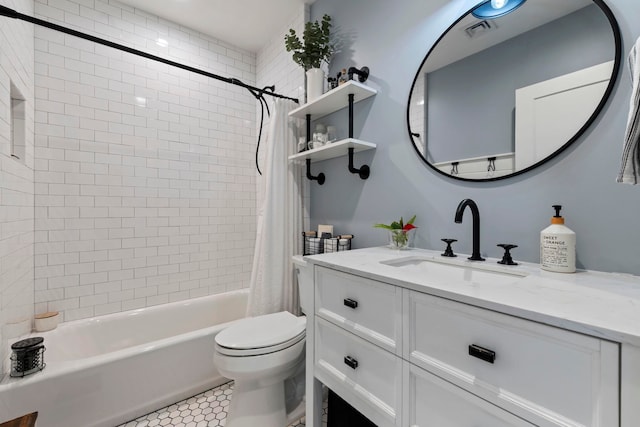 full bathroom with shower / bath combination with curtain, tile patterned floors, vanity, and toilet