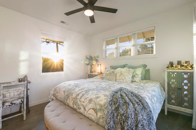 bedroom featuring dark hardwood / wood-style flooring and ceiling fan