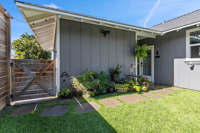 property entrance with a yard