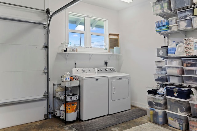 clothes washing area featuring washer and dryer