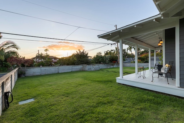 view of yard at dusk