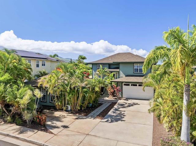 206 Kuli Puu St, Kihei, HI 96753 - view of front of house with concrete driveway, a garage, and a shingled roof