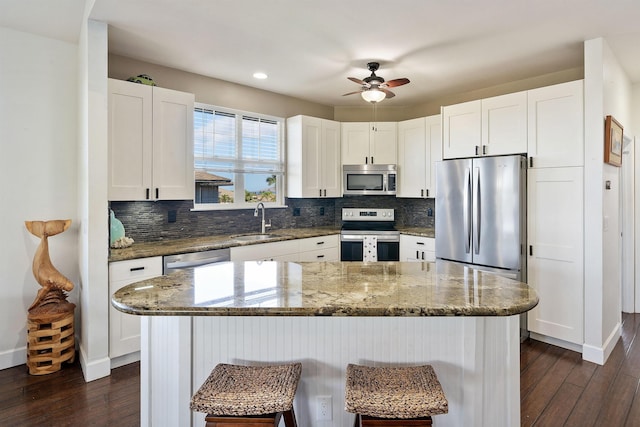 206 Kuli Puu St, Kihei, HI 96753 - kitchen featuring stainless steel appliances, a sink, dark wood-type flooring, backsplash, and recessed lighting