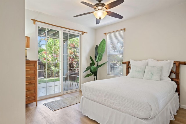 206 Kuli Puu St, Kihei, HI 96753 - bedroom with access to outside, wood finished floors, multiple windows, and ceiling fan