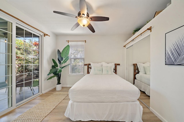 206 Kuli Puu St, Kihei, HI 96753 - bedroom featuring access to exterior, light wood-style flooring, a ceiling fan, and baseboards