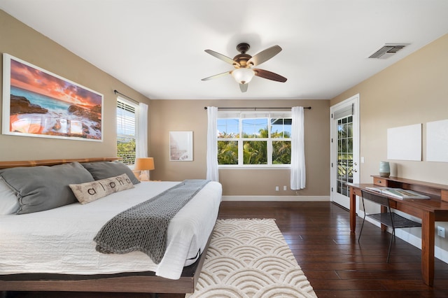 206 Kuli Puu St, Kihei, HI 96753 - bedroom with wood-type flooring, multiple windows, access to exterior, and baseboards