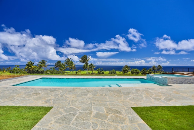 view of swimming pool featuring a water view and an in ground hot tub