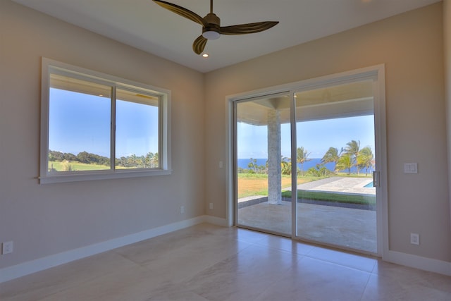 unfurnished room featuring ceiling fan