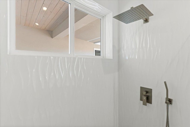 bathroom with a shower and wooden ceiling