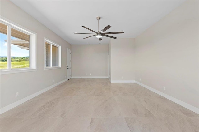 spare room with ceiling fan