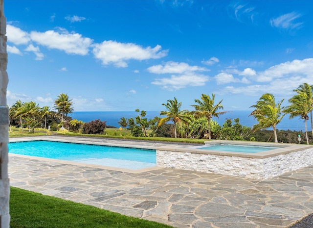 view of pool featuring an in ground hot tub and a water view