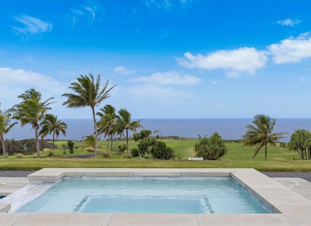 view of pool featuring a water view and a lawn