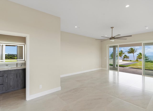 spare room featuring ceiling fan