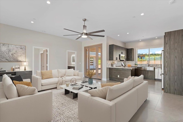 living room with sink and ceiling fan