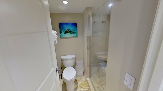 bathroom featuring toilet and walk in shower